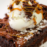 Ooey Gooey Brownie with chocolate covered potato chip ice cream on top!