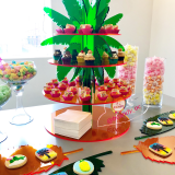 Coachella Inspired Dessert Display of Mini Cupcakes, Rainbow Cake Bites, Sugar Cookies, & Candy